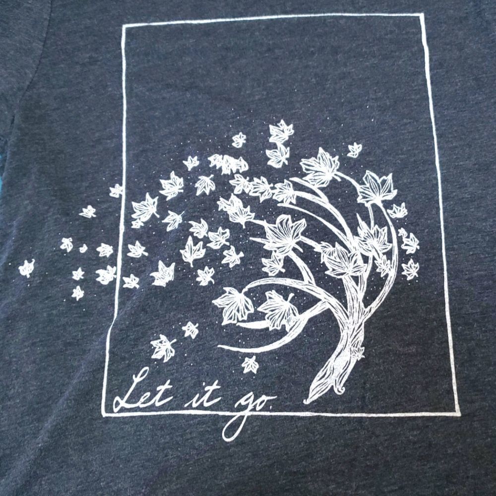 Human Unlimited 𝅺LET IT GO graphic tee leaves blowing - small